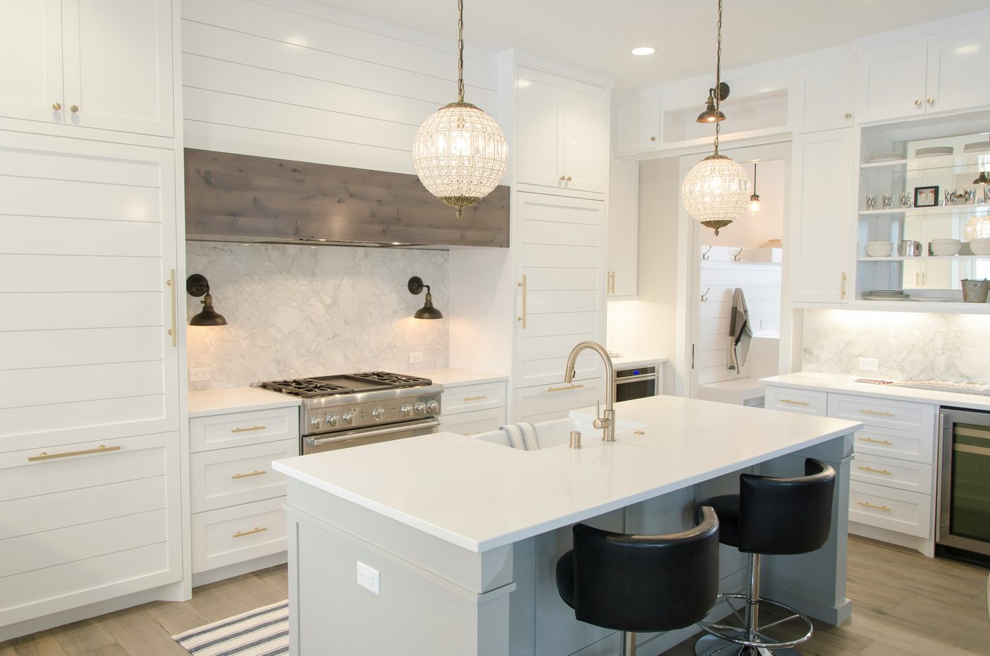 White shaker kitchen with marble backsplash