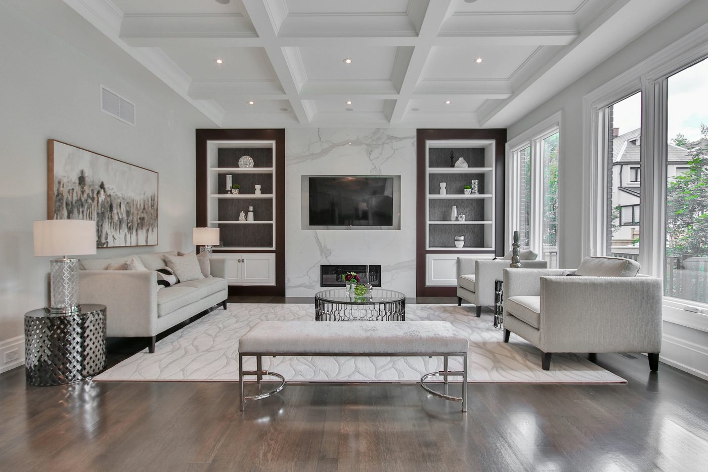 Formal living room with coffered ceiling and built-ins